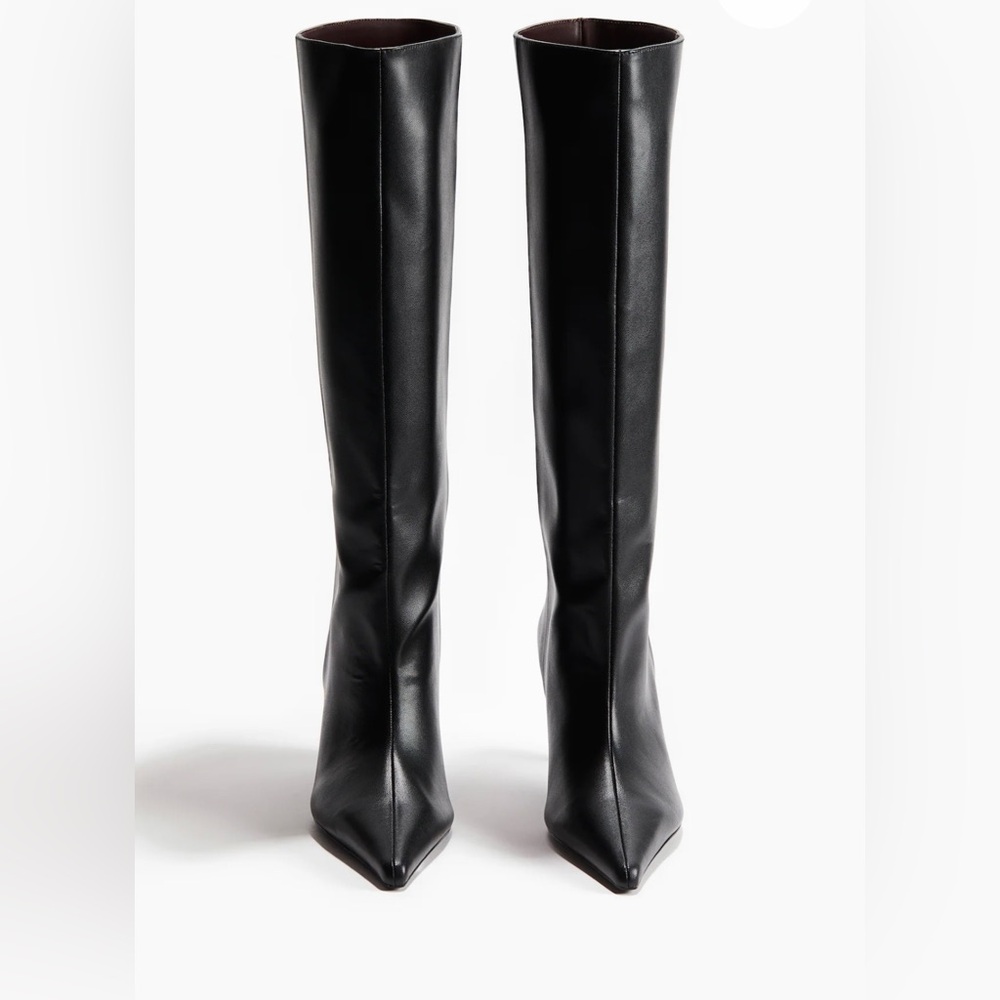 Knee-high boots with pointed toes and narrow heels. Satin linings and insoles.